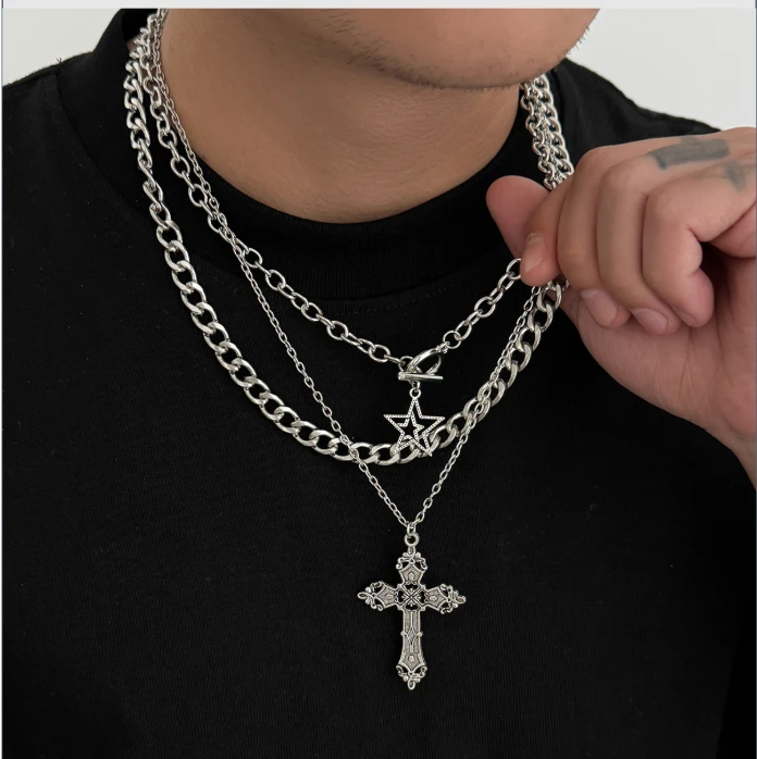 Layered silver chains with star and cross pendants